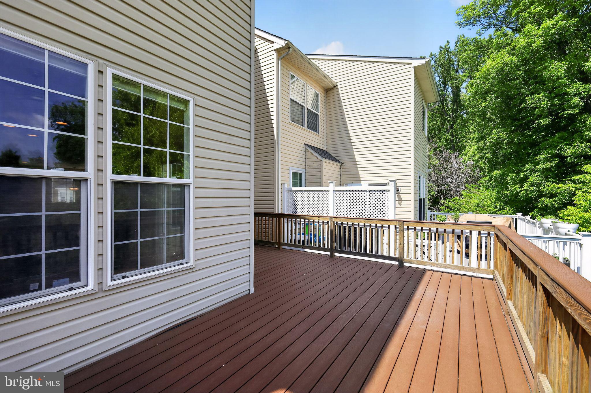 1034 Meandering Way Odenton, MD 21113 - Photo 17 of 30 a view of balcony with wooden floor and fence