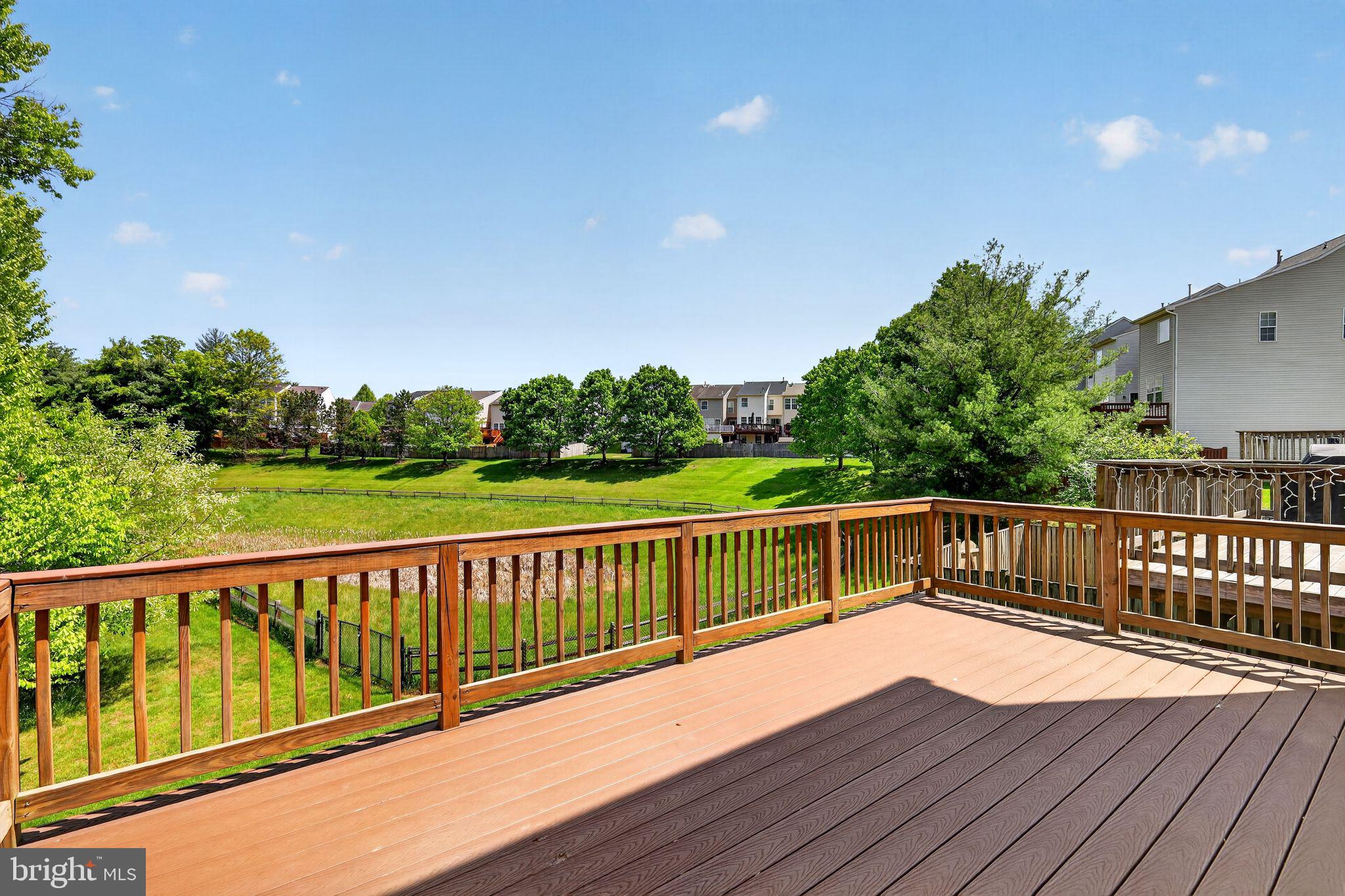 1034 Meandering Way Odenton, MD 21113 - Photo 18 of 30 a view of balcony with wooden floor and fence