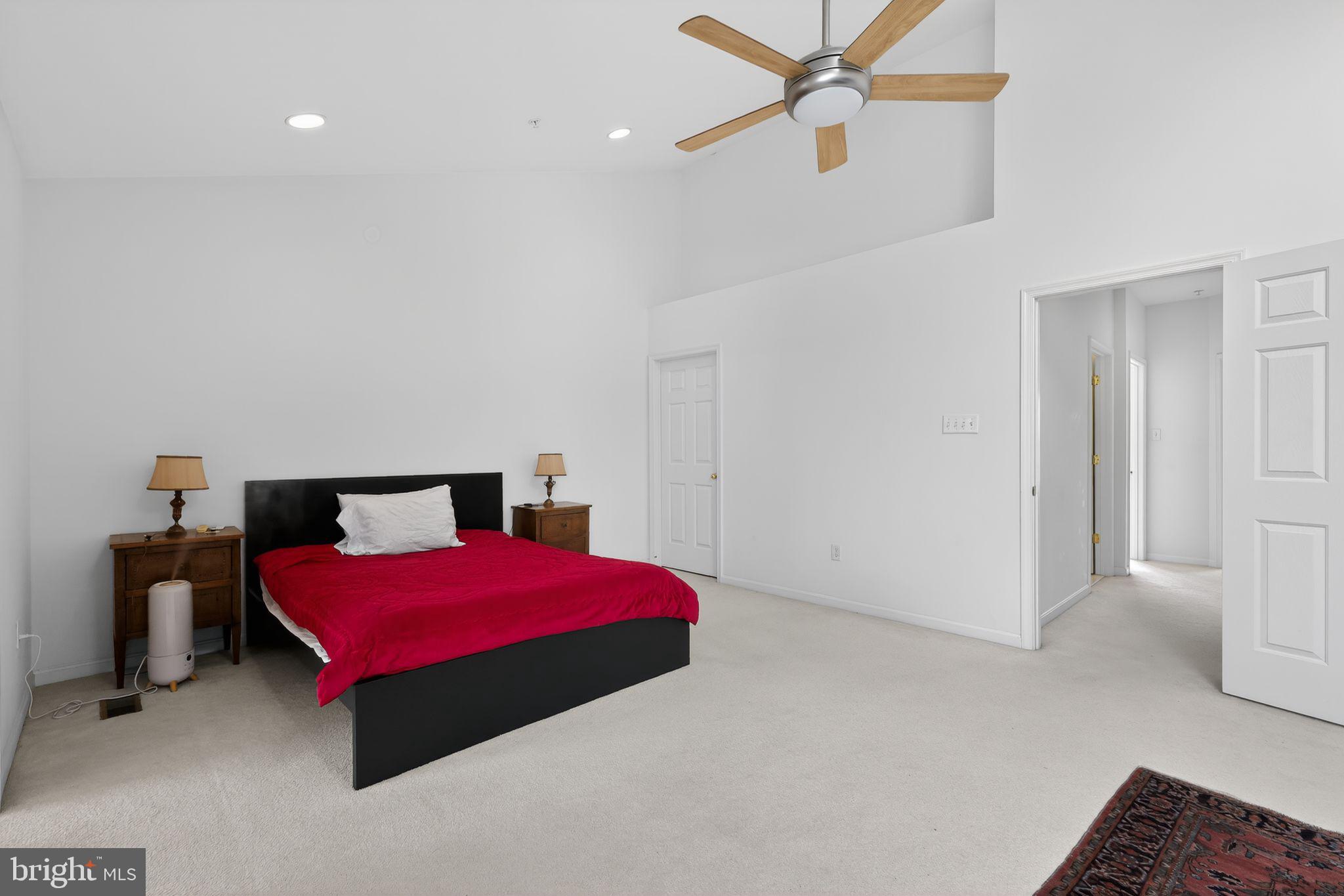 1034 Meandering Way Odenton, MD 21113 - Photo 20 of 30 a bedroom with a bed and a chandelier
