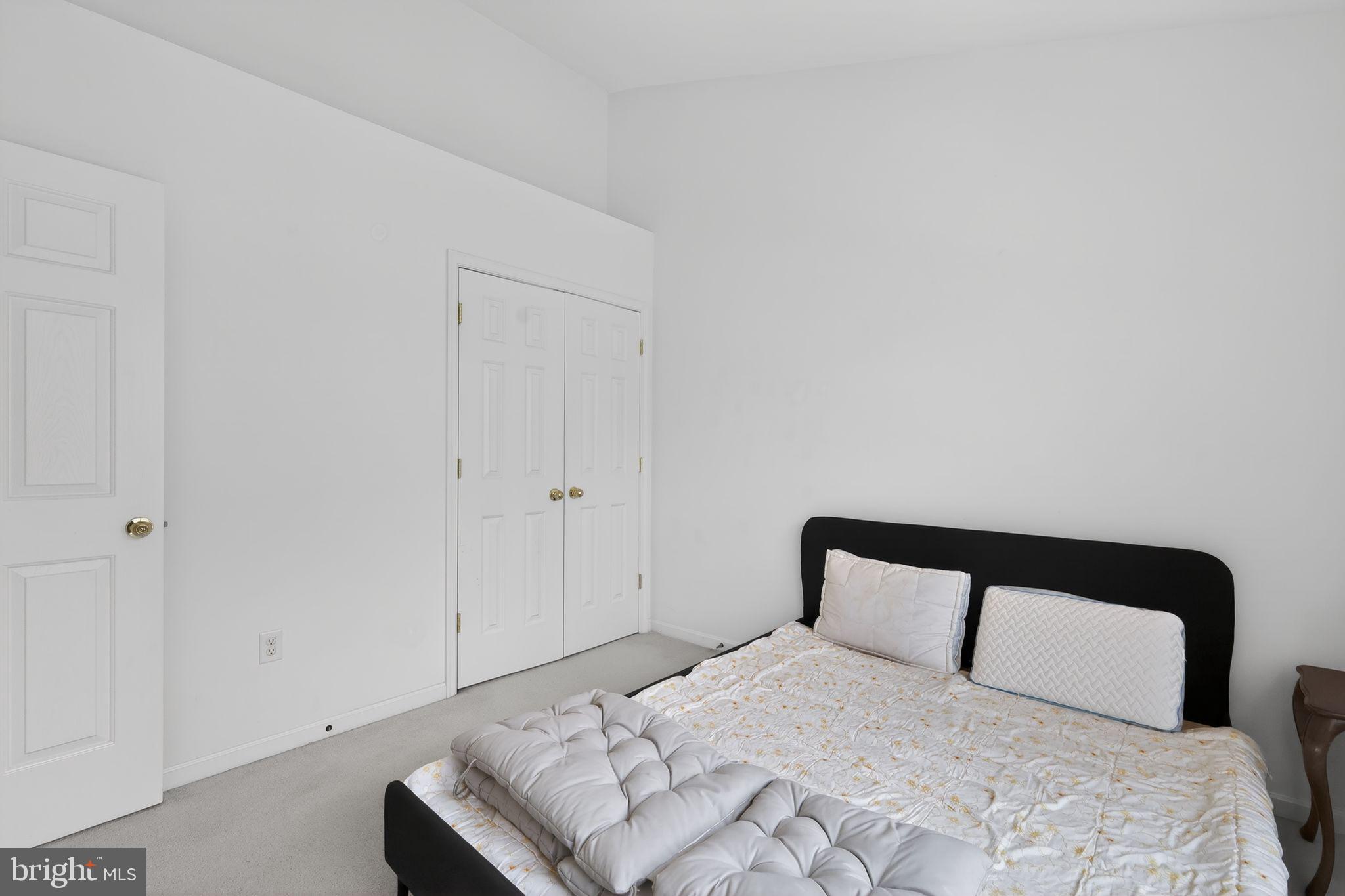 1034 Meandering Way Odenton, MD 21113 - Photo 27 of 30 a bedroom with a bed and a night stand
