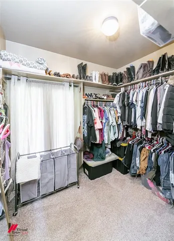 a spacious bathroom with a granite countertop sink and a mirror