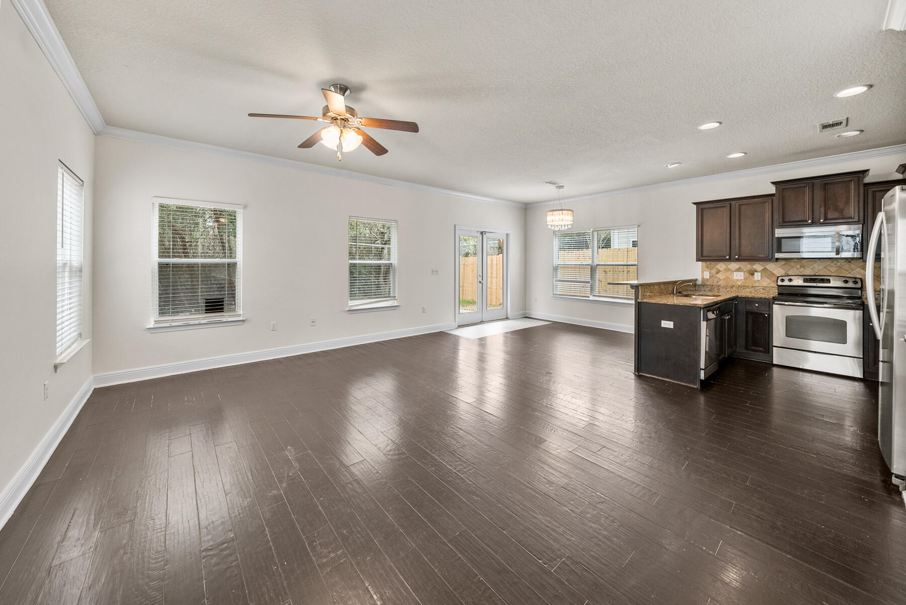 41 Hackberry Way Santa Rosa Beach, FL 32459 - Photo 18 of 27 a view of a kitchen with a sink cabinets wooden floor and a window