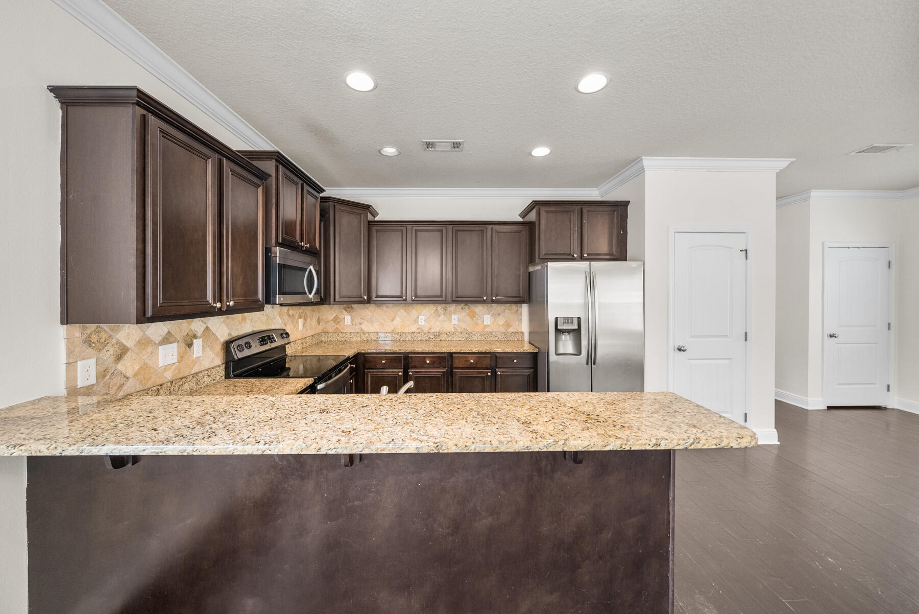 41 Hackberry Way Santa Rosa Beach, FL 32459 - Photo 21 of 27 a kitchen with stainless steel appliances granite countertop a sink a stove and a refrigerator