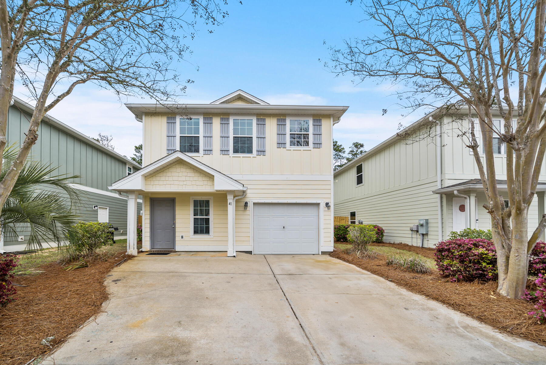 41 Hackberry Way Santa Rosa Beach, FL 32459 - Photo 26 of 27 a front view of a house with a yard and garage