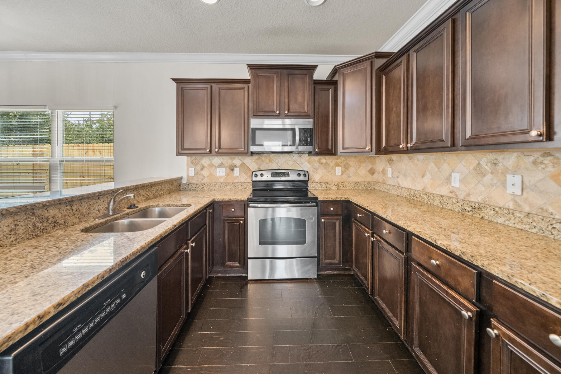 41 Hackberry Way Santa Rosa Beach, FL 32459 - Photo 3 of 27 a kitchen with a sink stove top oven and cabinets