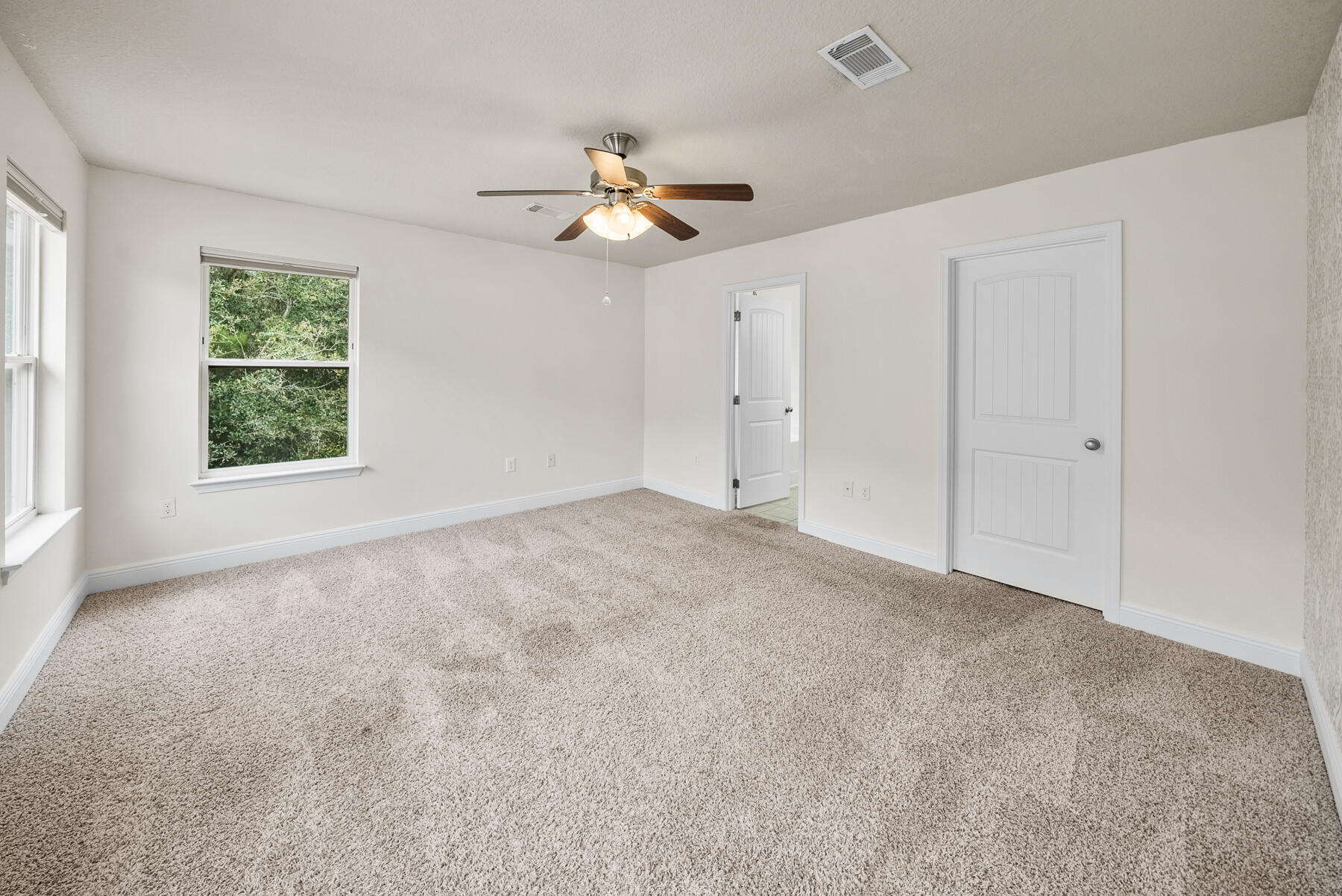 41 Hackberry Way Santa Rosa Beach, FL 32459 - Photo 6 of 27 an empty room with windows and fan
