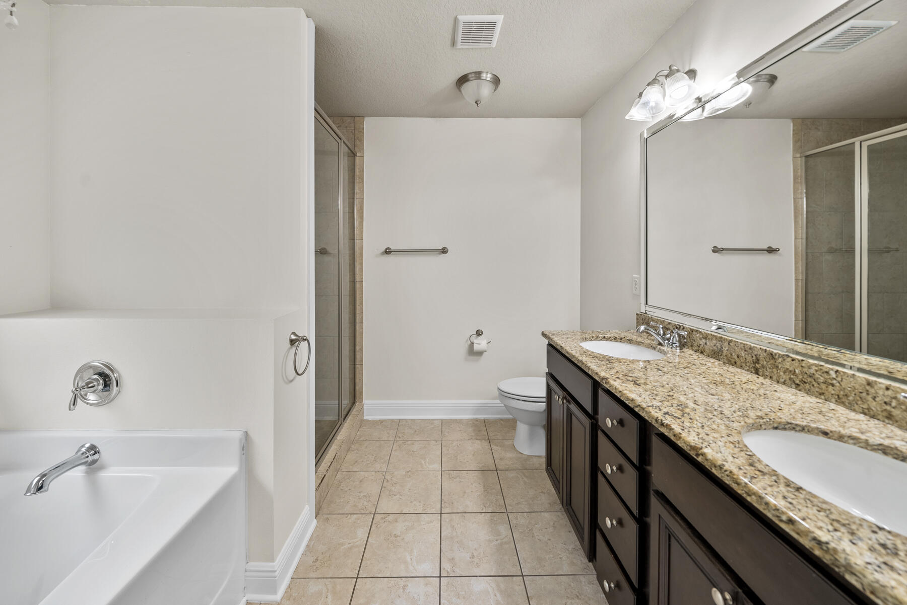 41 Hackberry Way Santa Rosa Beach, FL 32459 - Photo 8 of 27 a spacious bathroom with a granite countertop sink a mirror and a bathtub