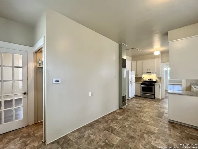 a view of a kitchen with furniture and a fireplace
