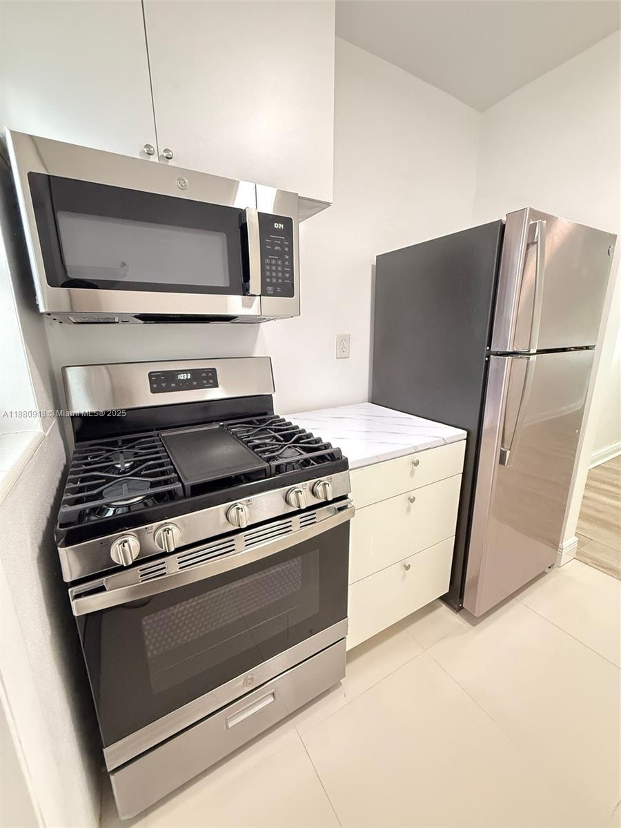 542 Euclid Avenue, Unit 4 Miami Beach, FL 33139 - Photo 1 of 10 a stove top oven sitting inside of a kitchen