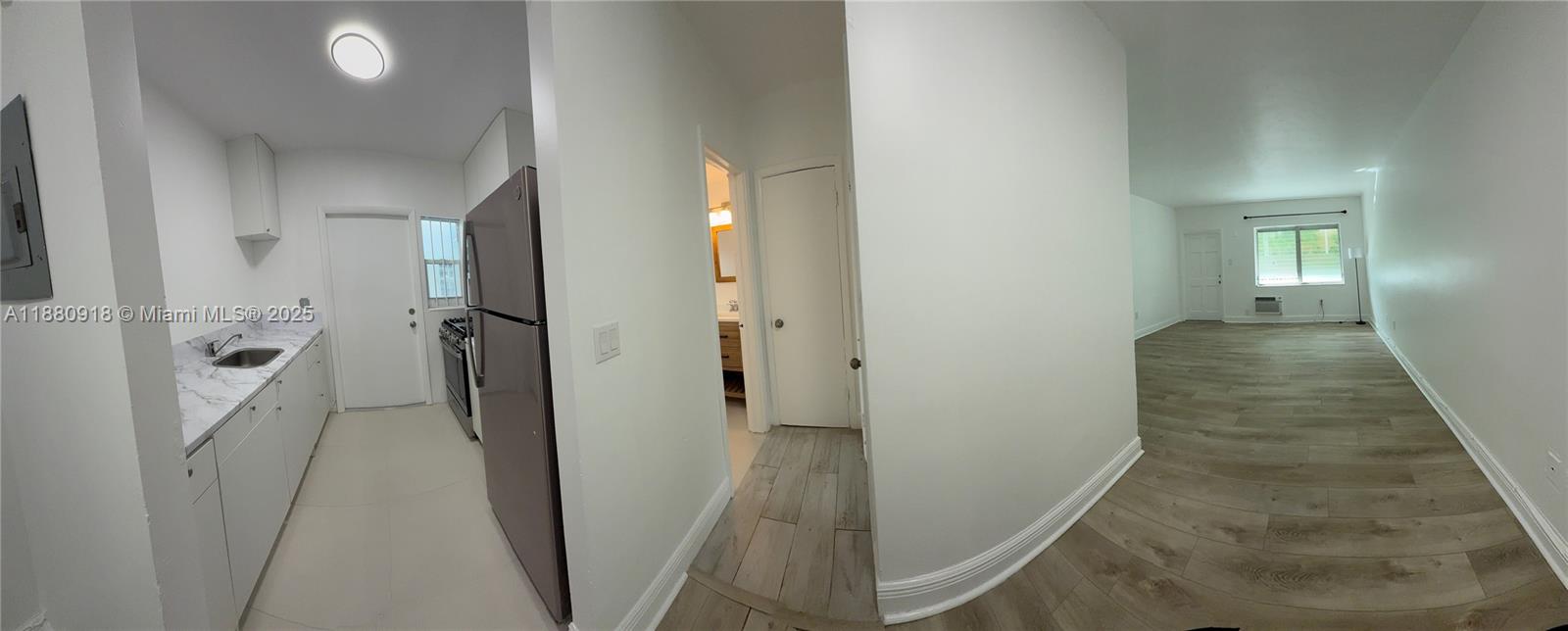 542 Euclid Avenue, Unit 4 Miami Beach, FL 33139 - Photo 9 of 10 a view of a hallway with a room