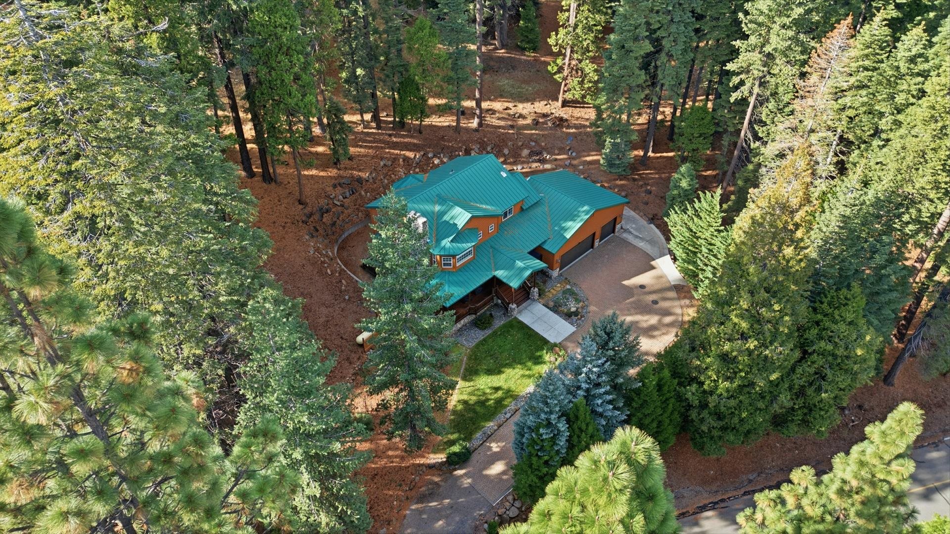 1017 Timber Ridge Road Lake Almanor, CA 96137 - Photo 40 of 45 an aerial view of a house with a yard