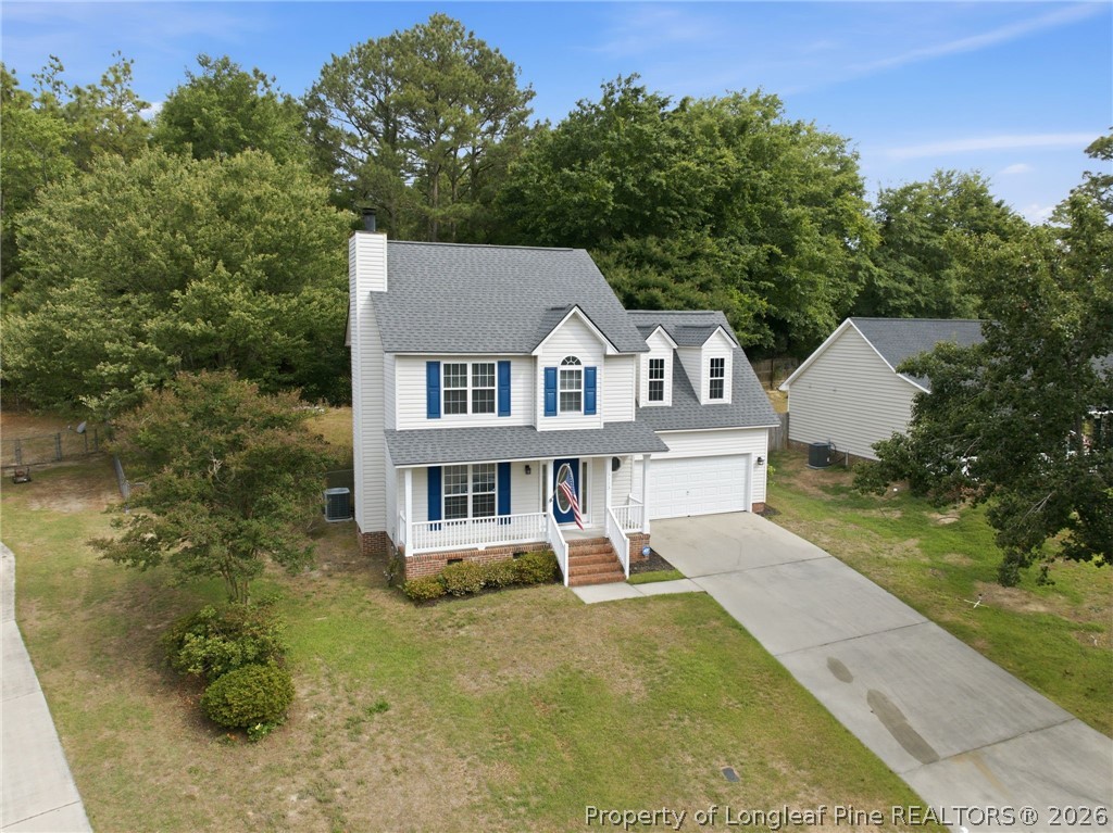 5113 Archer Road Hope Mills, NC 28348 - Photo 4 of 41 a view of a house with a yard