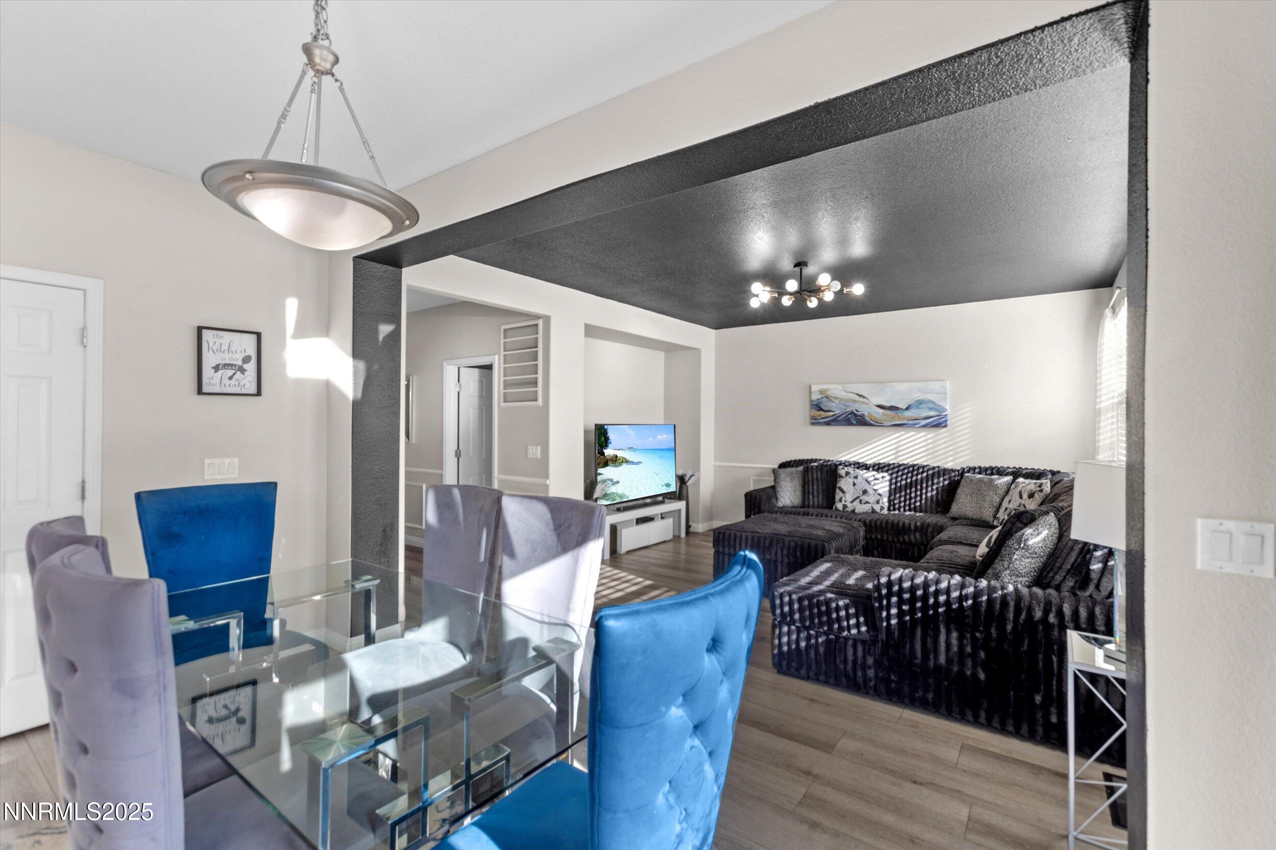 8922 Sorcha Street Reno, NV 89506 - Photo 15 of 47 a living room with furniture and a wooden floor