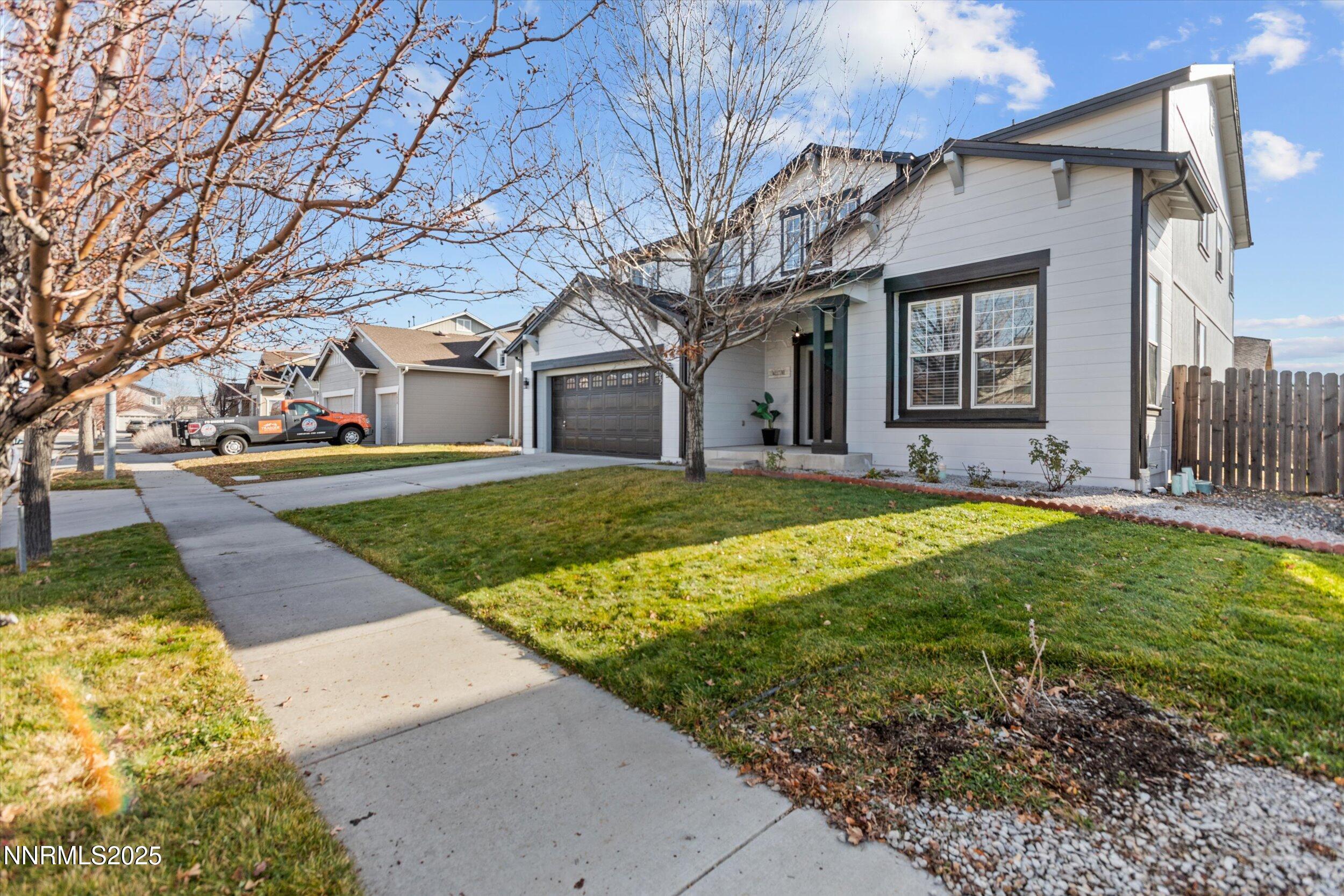 8922 Sorcha Street Reno, NV 89506 - Photo 2 of 47 a view of a house with a yard patio and fire pit