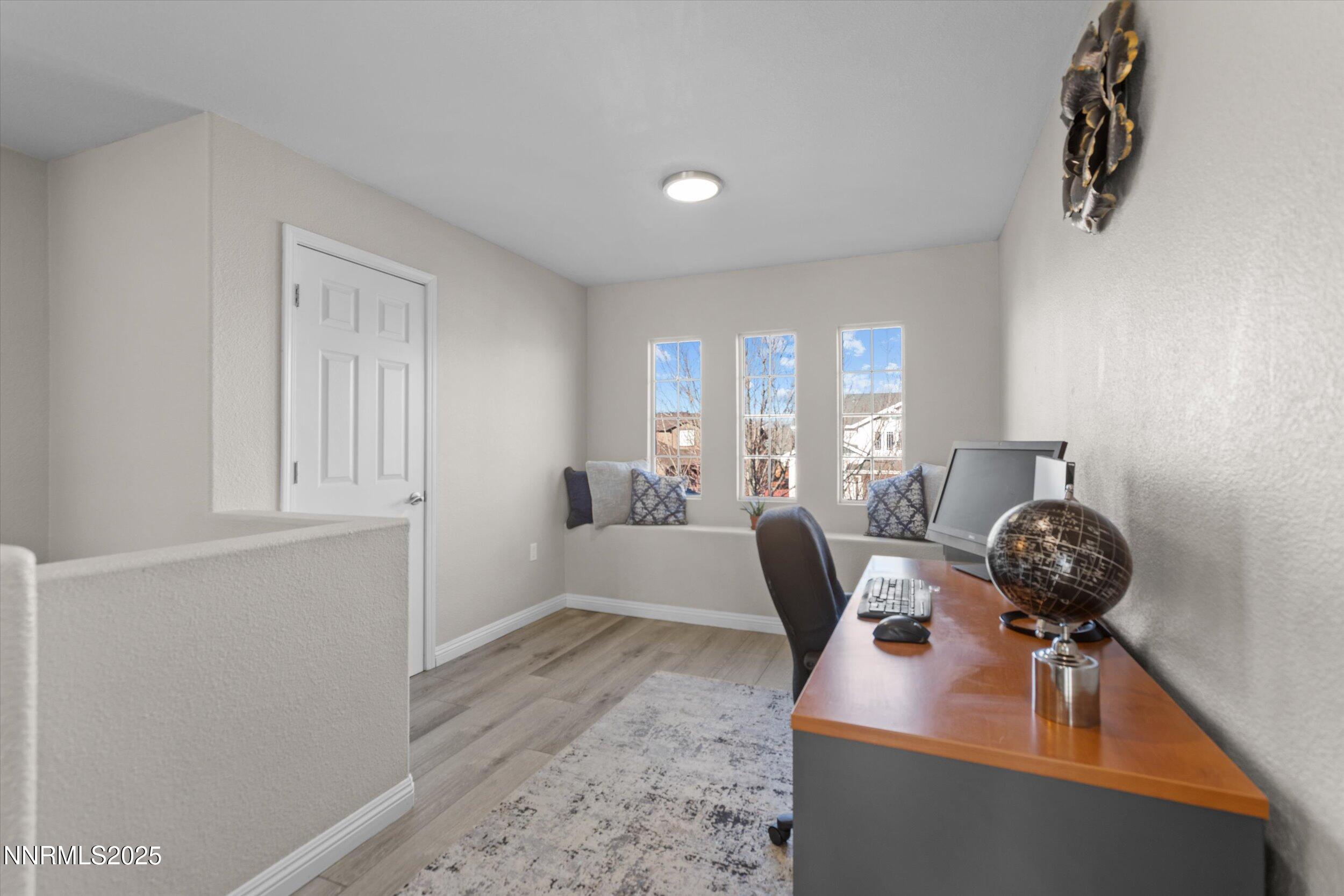 8922 Sorcha Street Reno, NV 89506 - Photo 22 of 47 a view of a livingroom with furniture and windows