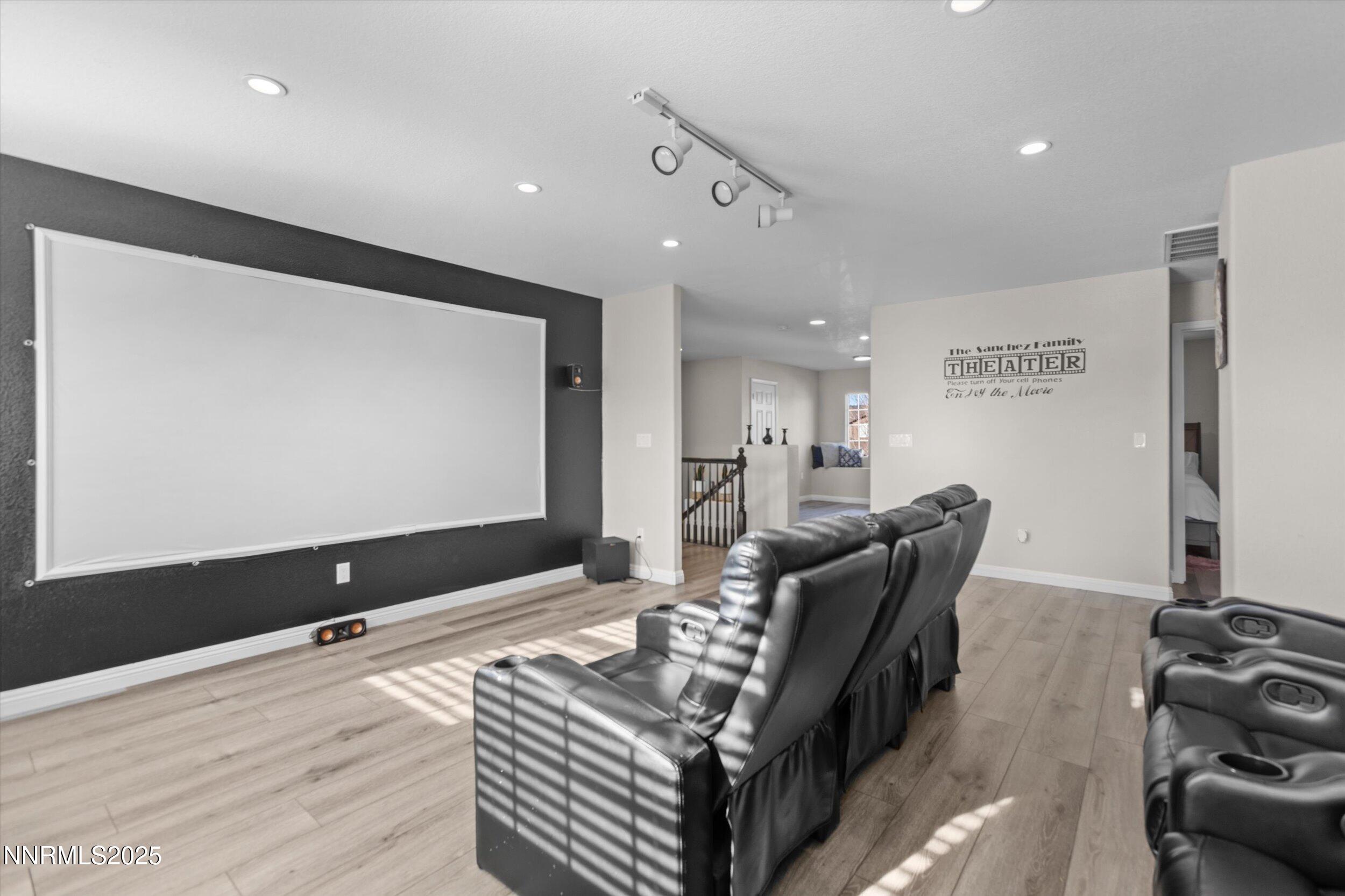 8922 Sorcha Street Reno, NV 89506 - Photo 25 of 47 a living room with furniture and a flat screen tv