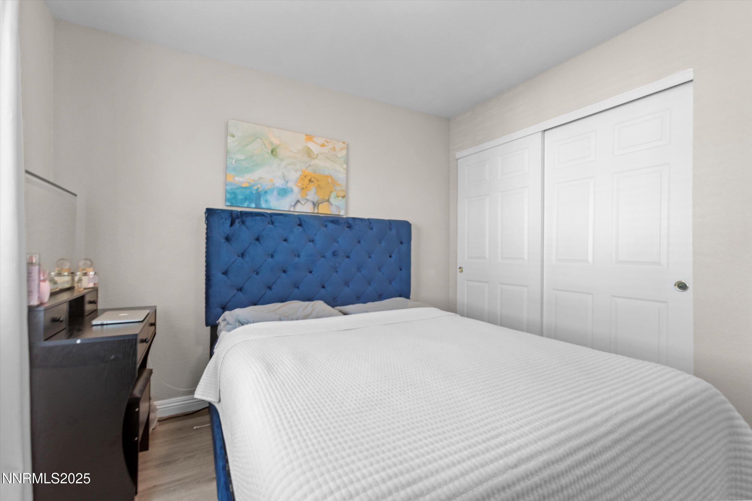 8922 Sorcha Street Reno, NV 89506 - Photo 37 of 47 a bedroom with a bed and a desk