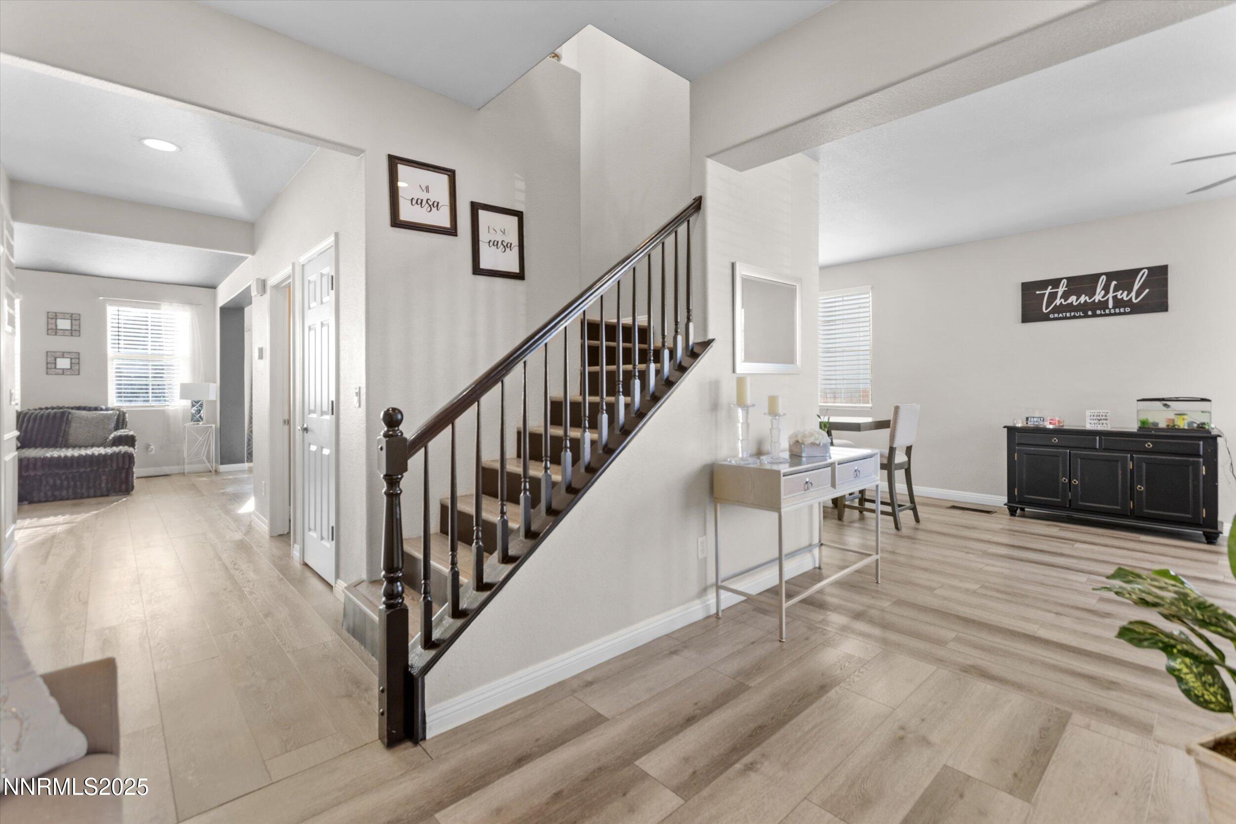 8922 Sorcha Street Reno, NV 89506 - Photo 7 of 47 a view of a livingroom with furniture and stairs