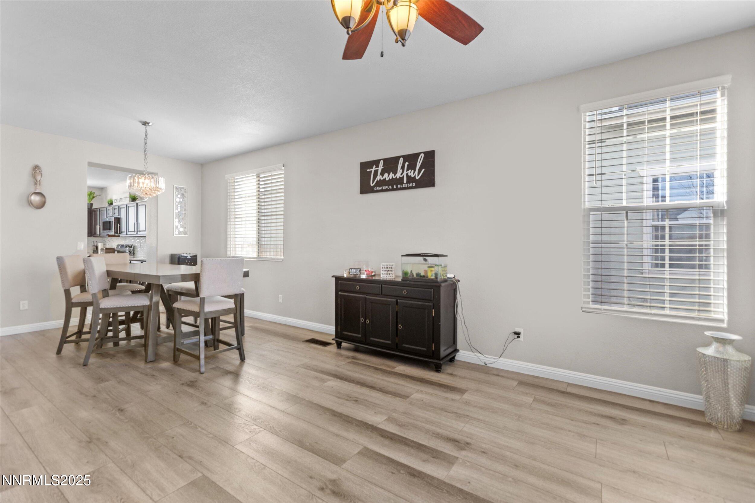 8922 Sorcha Street Reno, NV 89506 - Photo 9 of 47 a living room with furniture and a wooden floor
