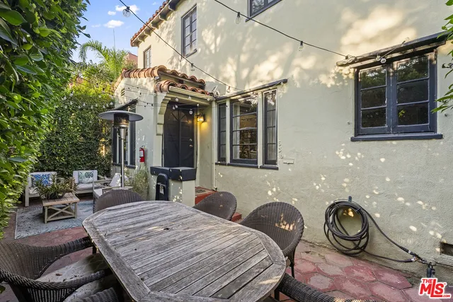 a view of yard with patio
