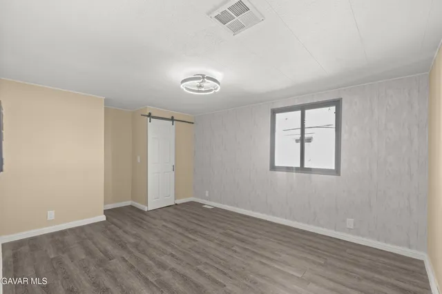 a bathroom with a toilet a sink and shower