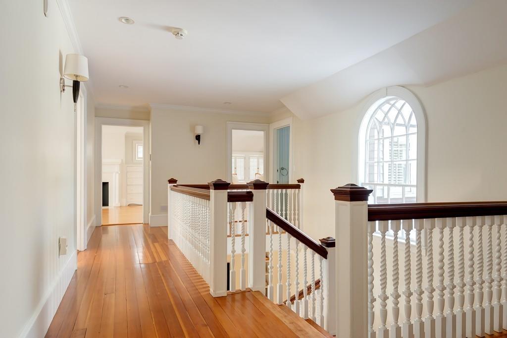 67 Longfellow Road Wellesley, MA 02481 - Photo 14 of 26 a view of a hallway with wooden floor and staircase
