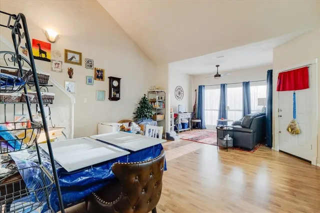 a view of a livingroom with furniture and a flat screen tv