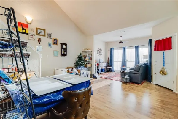 a view of a livingroom with furniture and a flat screen tv