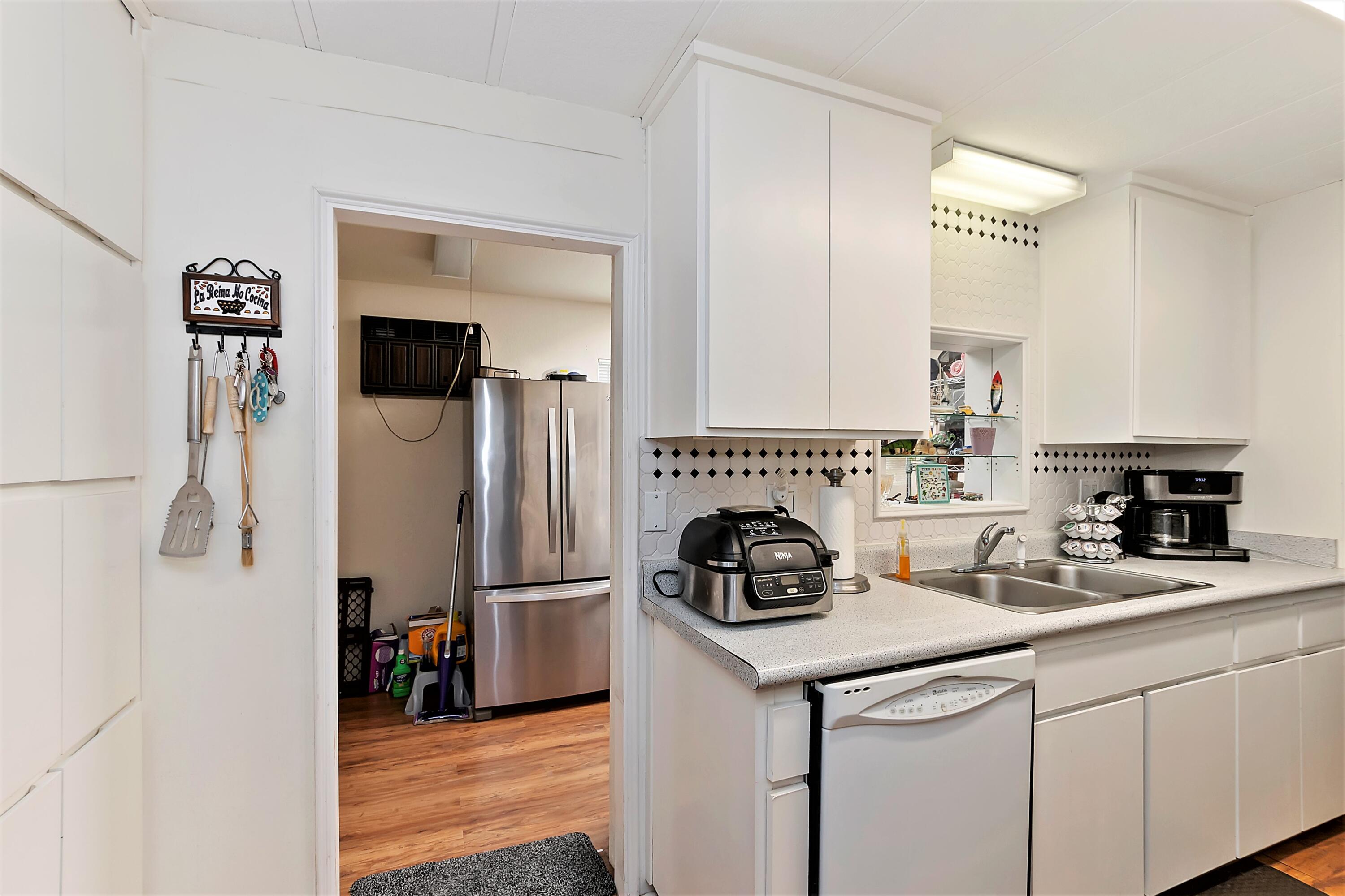 74711 Dillon Road, Unit 331 Desert Hot Springs, CA 92241 - Photo 18 of 53 a kitchen with a refrigerator and a sink