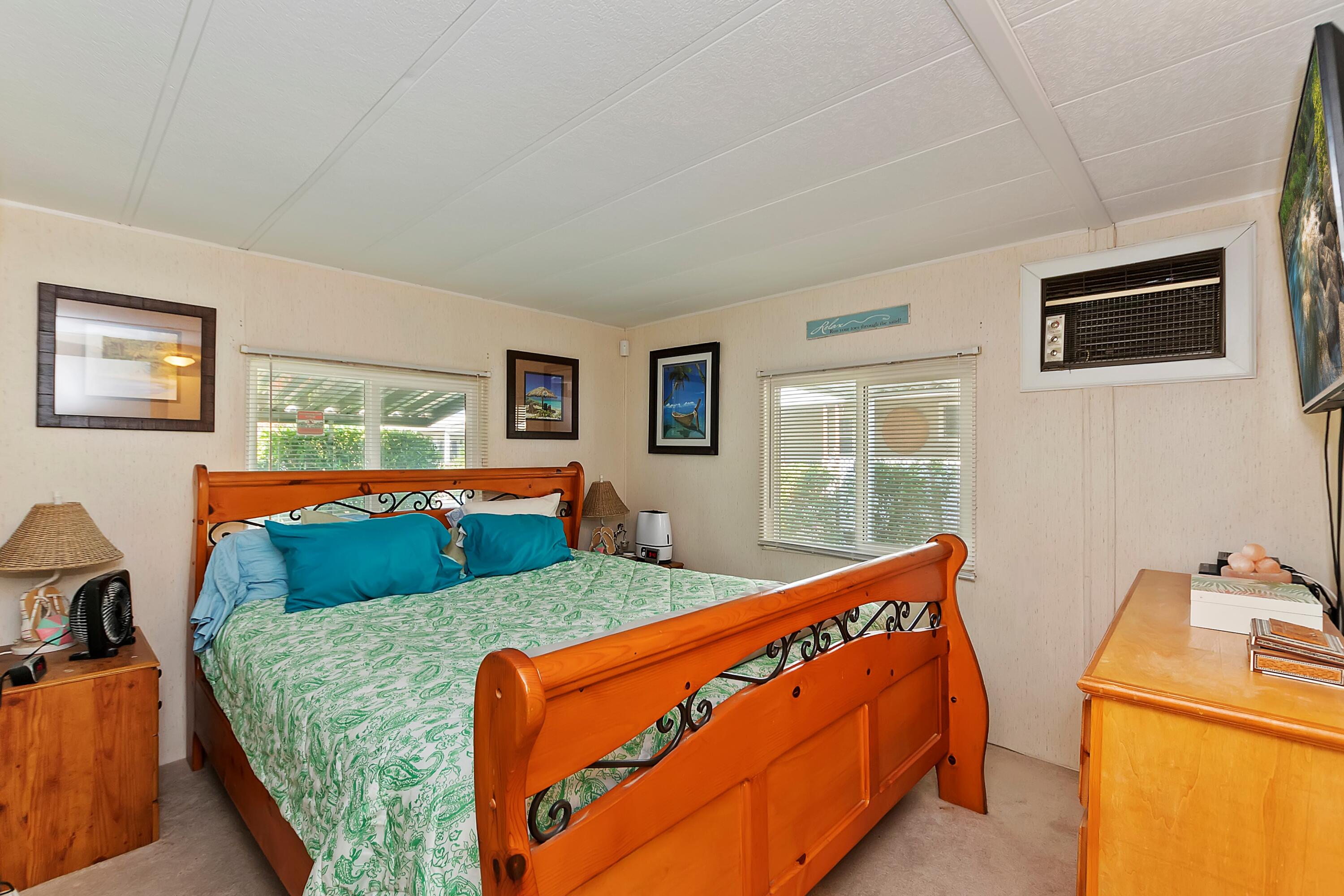 74711 Dillon Road, Unit 331 Desert Hot Springs, CA 92241 - Photo 25 of 53 a bedroom with two beds and wooden floor