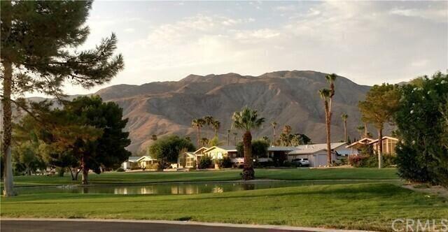 74711 Dillon Road, Unit 331 Desert Hot Springs, CA 92241 - Photo 49 of 53 a view of a town with barn and large trees