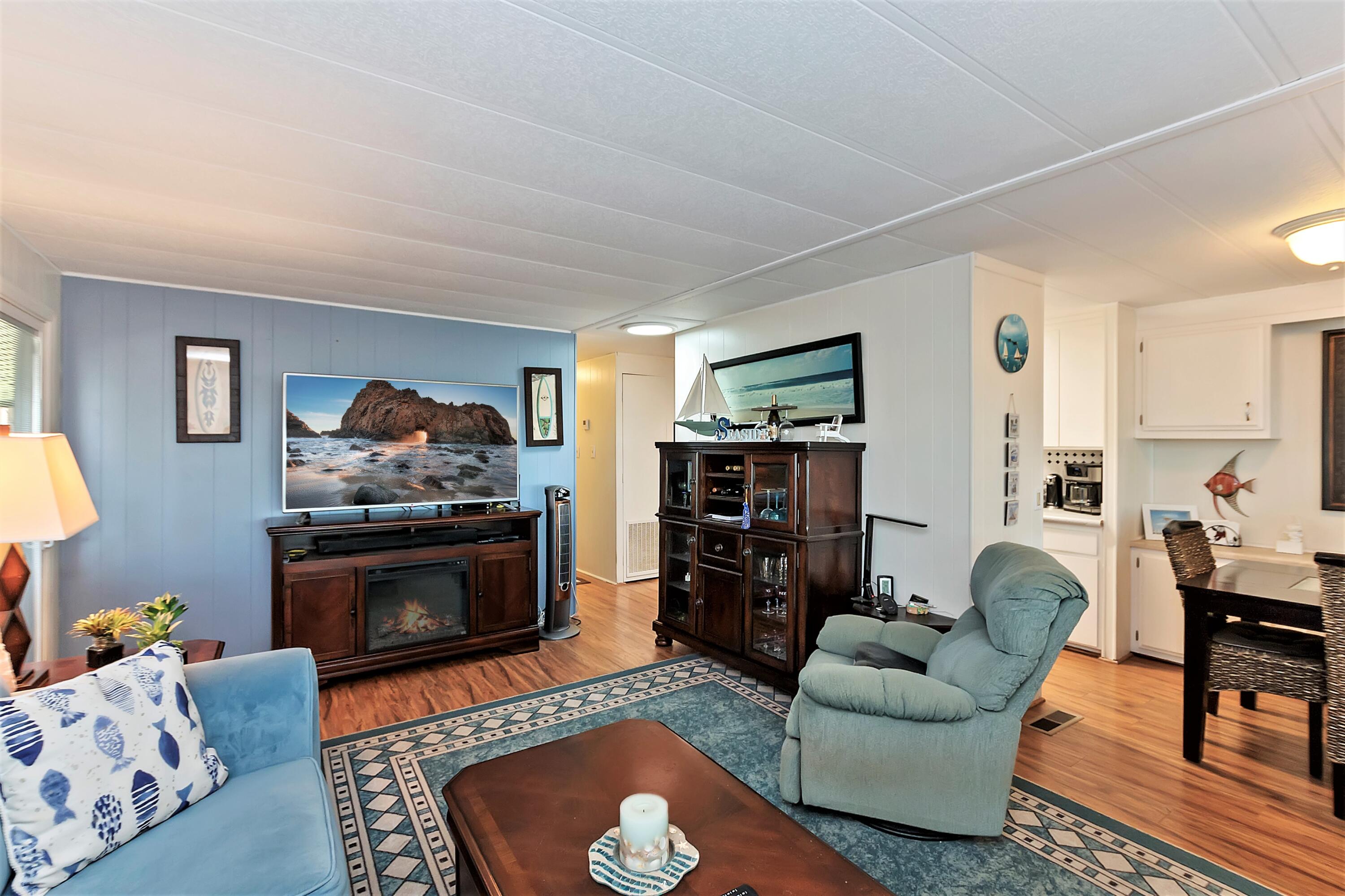 74711 Dillon Road, Unit 331 Desert Hot Springs, CA 92241 - Photo 10 of 53 a living room with furniture and a fireplace
