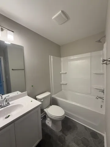 a bathroom with a toilet a sink and a bathtub