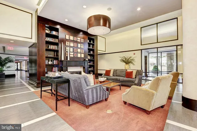 a room with gym equipment and a view of living room