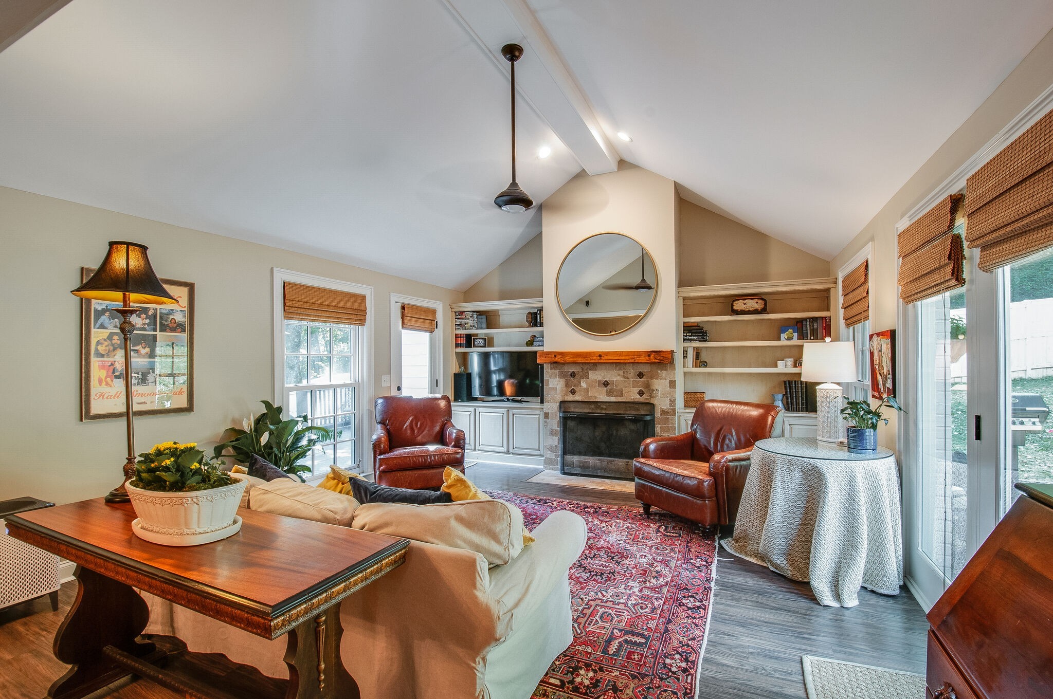 4602 Benton Smith Road Nashville, TN 37215 - Photo 13 of 36 a living room with furniture a fireplace and a flat screen tv