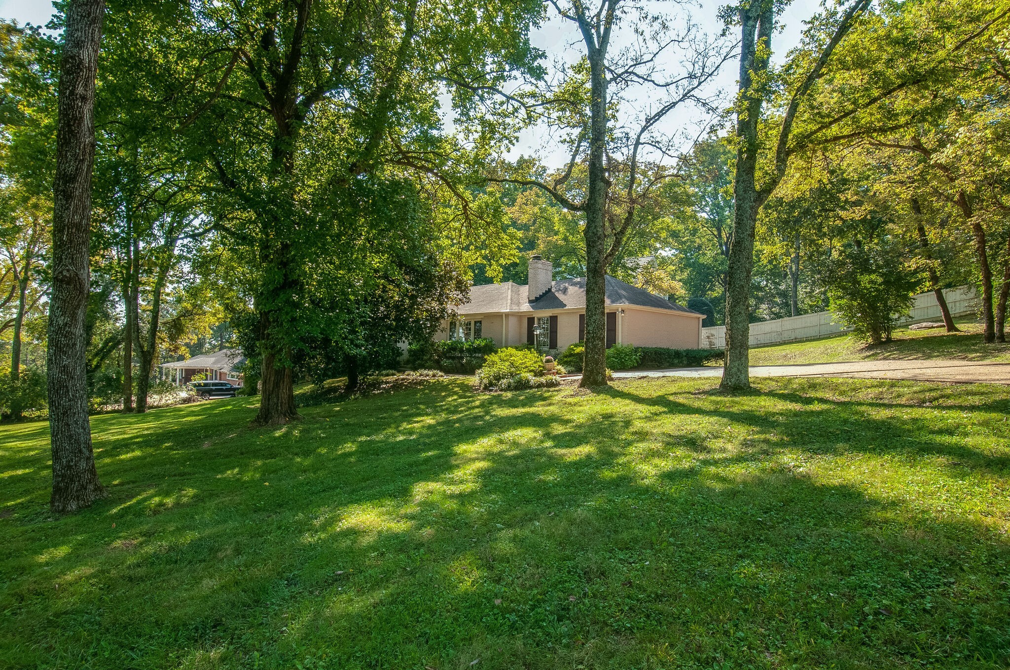 4602 Benton Smith Road Nashville, TN 37215 - Photo 2 of 36 a backyard of a house with lots of green space