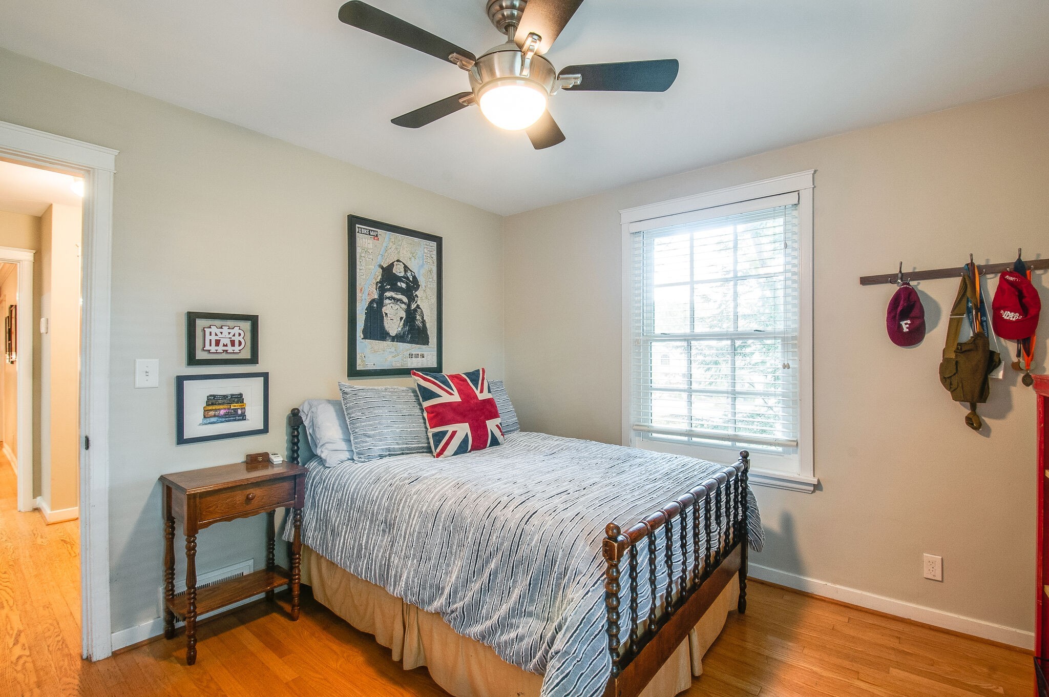 4602 Benton Smith Road Nashville, TN 37215 - Photo 24 of 36 a bedroom with a bed and a chandelier