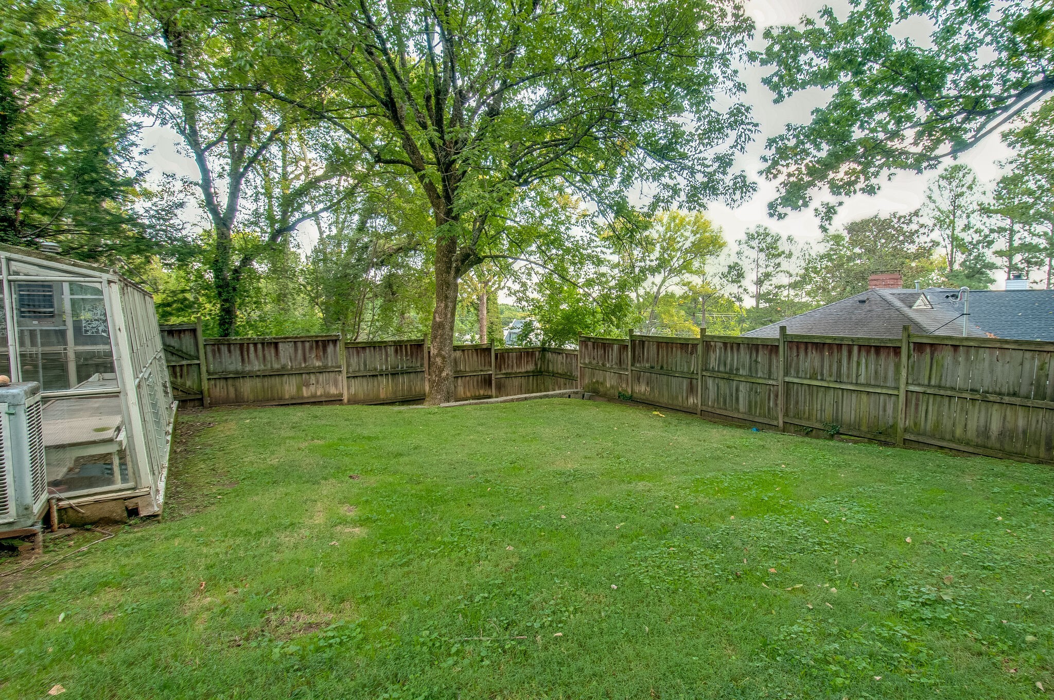 4602 Benton Smith Road Nashville, TN 37215 - Photo 31 of 36 a view of a backyard with wooden fence and a large tree