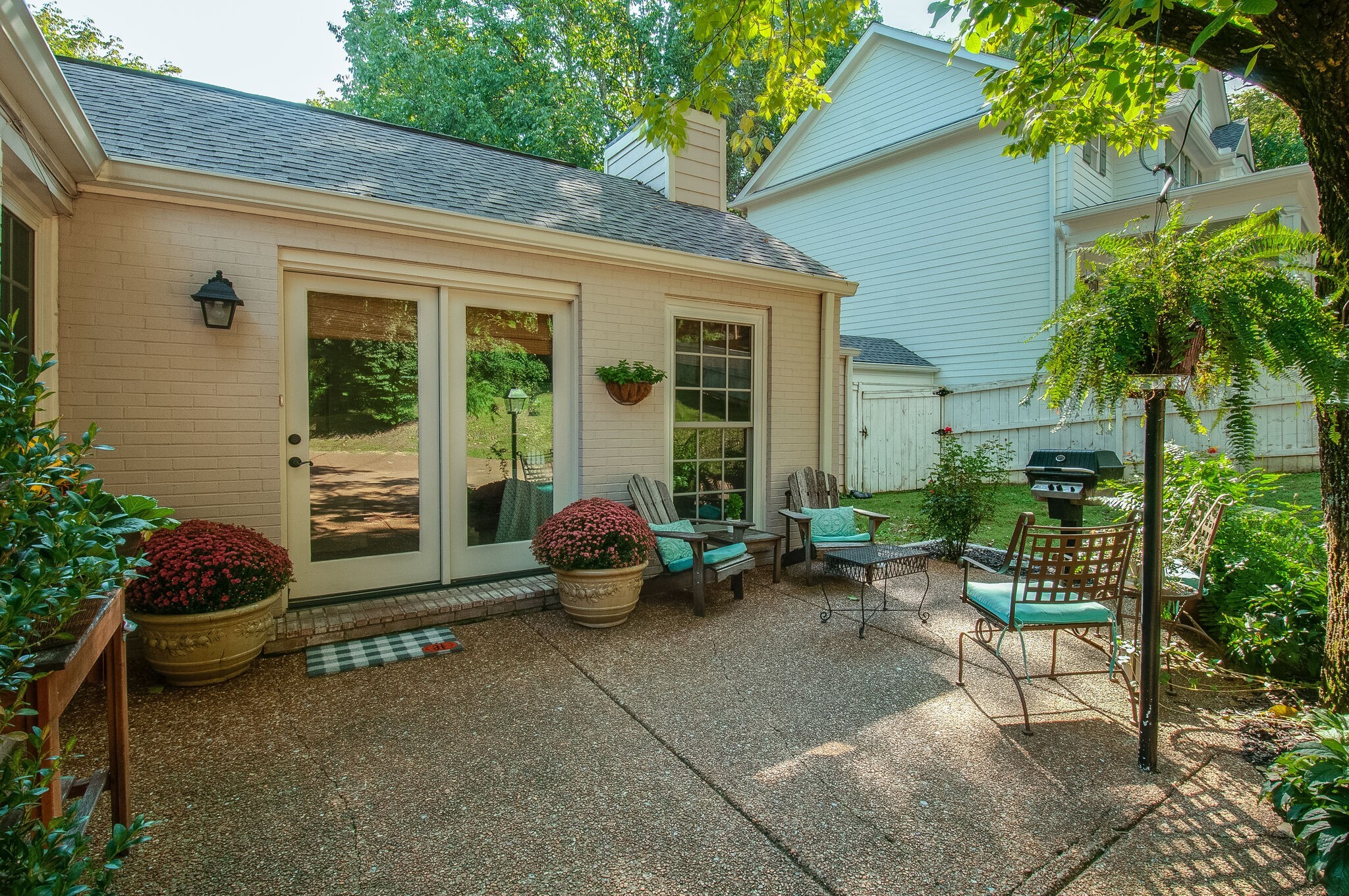4602 Benton Smith Road Nashville, TN 37215 - Photo 35 of 36 a backyard of a house with outdoor seating and plants