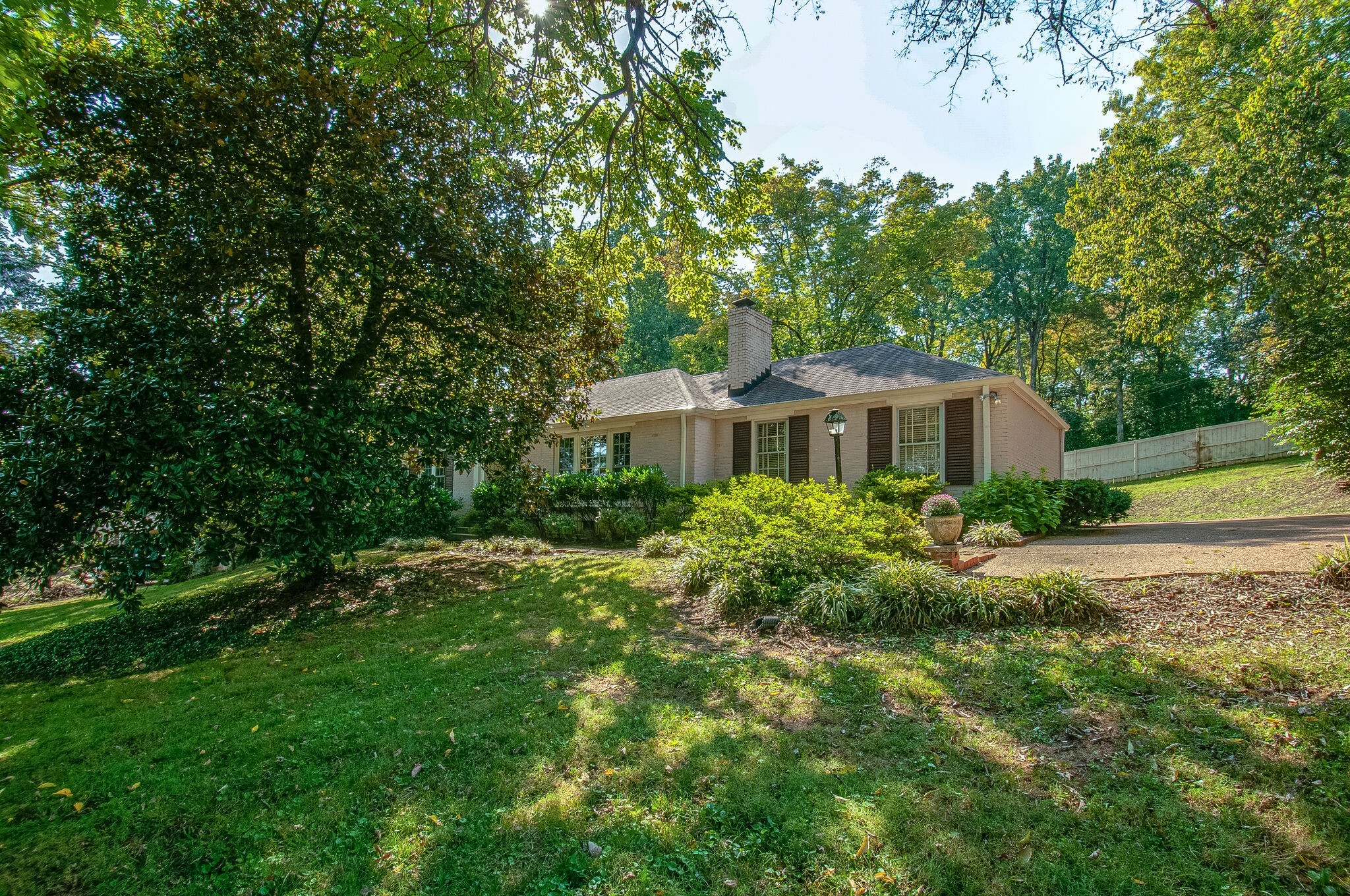 4602 Benton Smith Road Nashville, TN 37215 - Photo 4 of 36 a front view of a house with a yard and trees