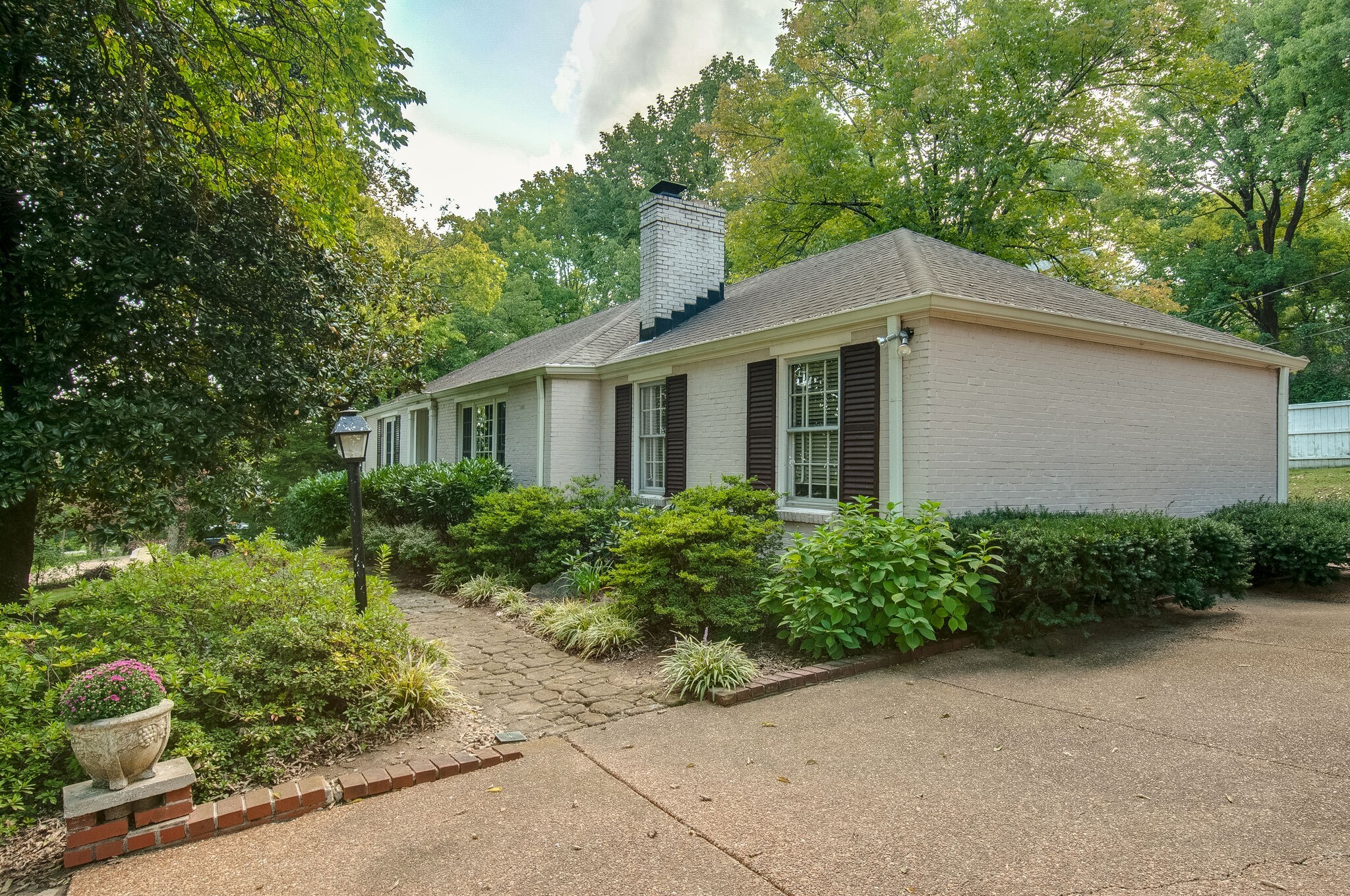 4602 Benton Smith Road Nashville, TN 37215 - Photo 5 of 36 a front view of a house with garden