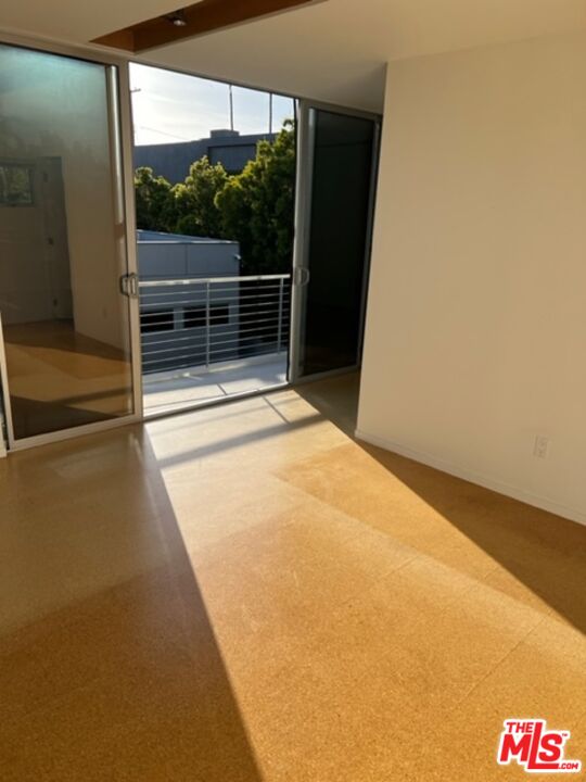 2030 Walnut Avenue Venice, CA 90291 - Photo 13 of 20 a view of an empty room with a sliding door