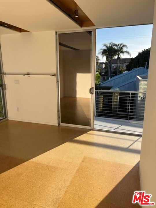 2030 Walnut Avenue Venice, CA 90291 - Photo 15 of 20 a bedroom with a bed and a potted plant on it