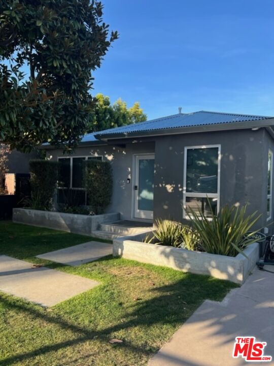 2030 Walnut Avenue Venice, CA 90291 - Photo 2 of 20 a front view of a house with garden