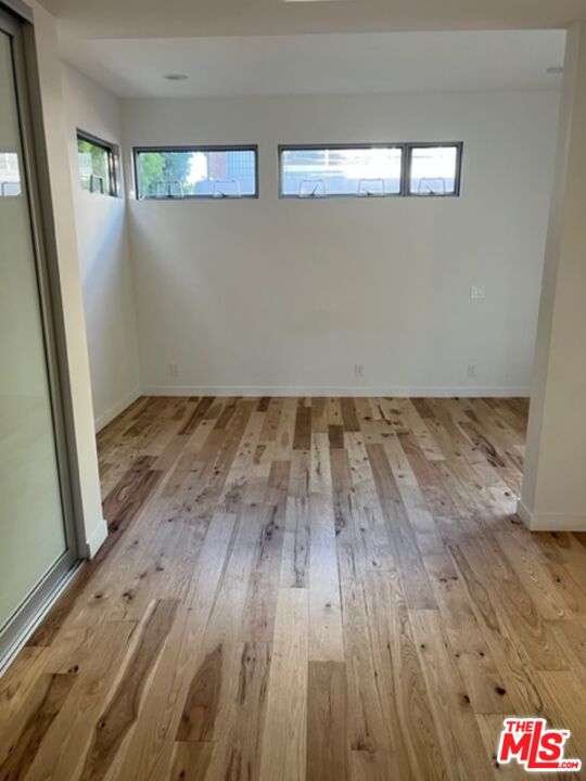 2030 Walnut Avenue Venice, CA 90291 - Photo 8 of 20 an empty room with wooden floor and windows