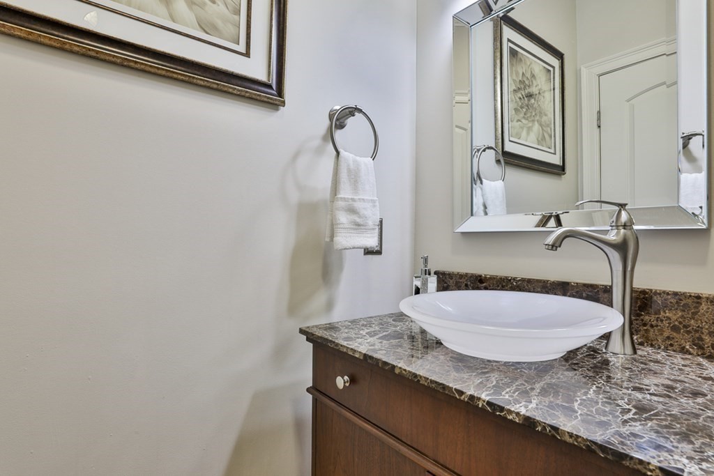 3 Dolan Drive, Unit 3 Middleton, MA 01949 - Photo 18 of 34 a bathroom with a granite countertop sink and a mirror
