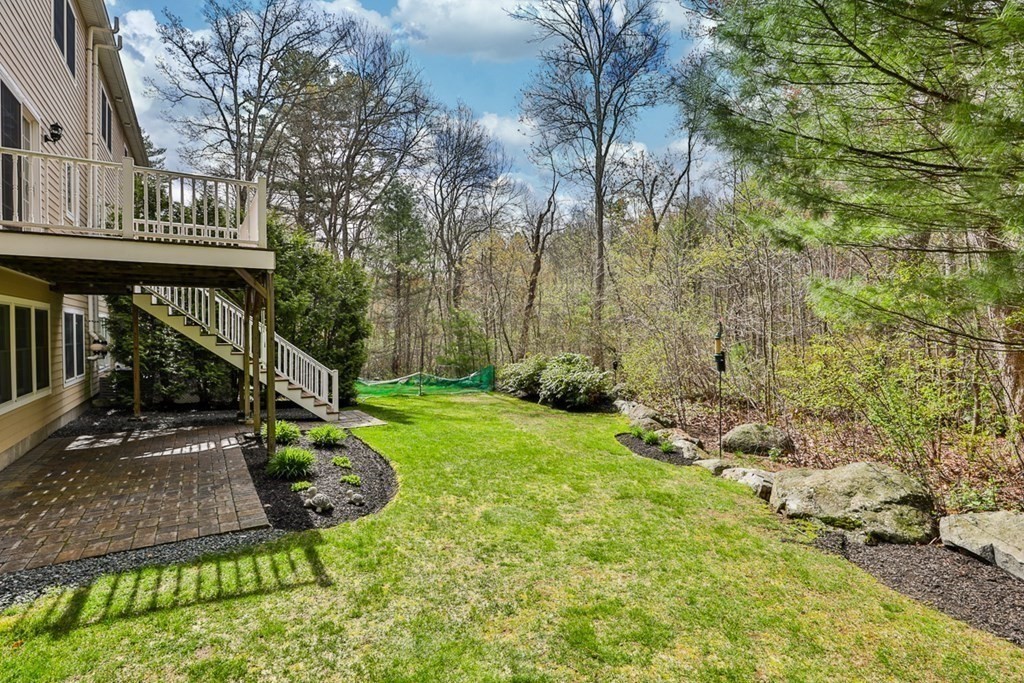 3 Dolan Drive, Unit 3 Middleton, MA 01949 - Photo 32 of 34 a view of a chair and table in the patio