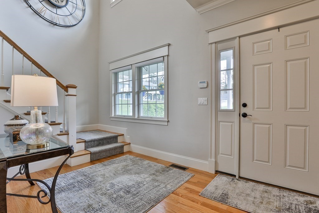 3 Dolan Drive, Unit 3 Middleton, MA 01949 - Photo 4 of 34 a living room with furniture and a rug