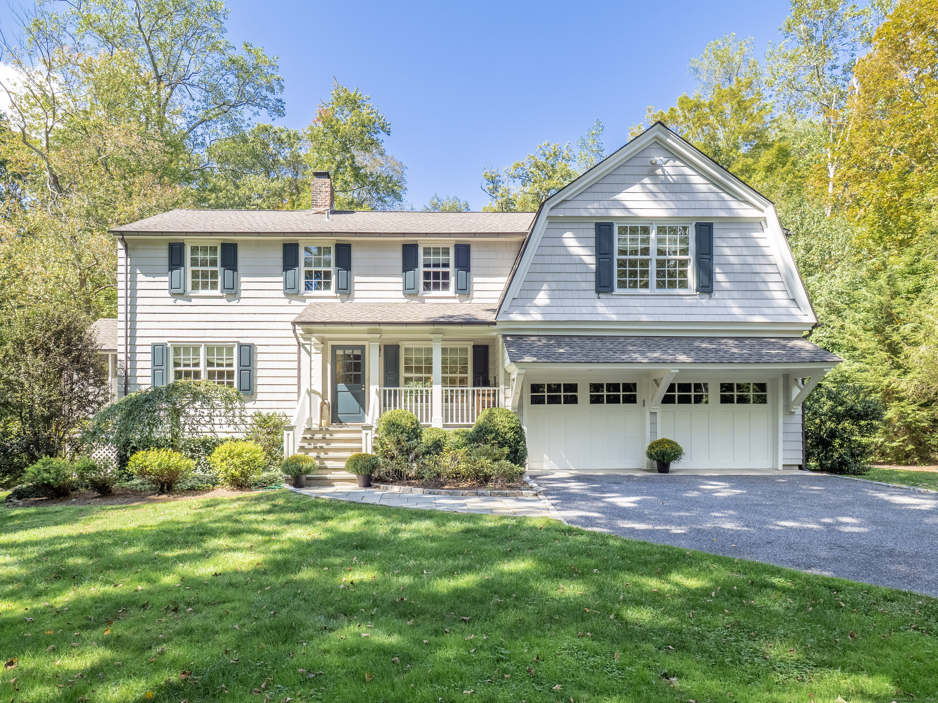 250 Old Grumman Hill Road Wilton, CT 06897 - Photo 1 of 1 a front view of a house with garden