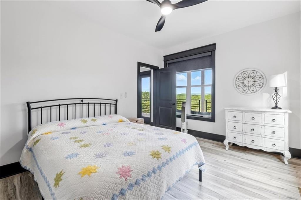 1379 Foxhound Trail Northeast Ranger, GA 30734 - Photo 21 of 42 a large bed sitting in a bedroom next to a window